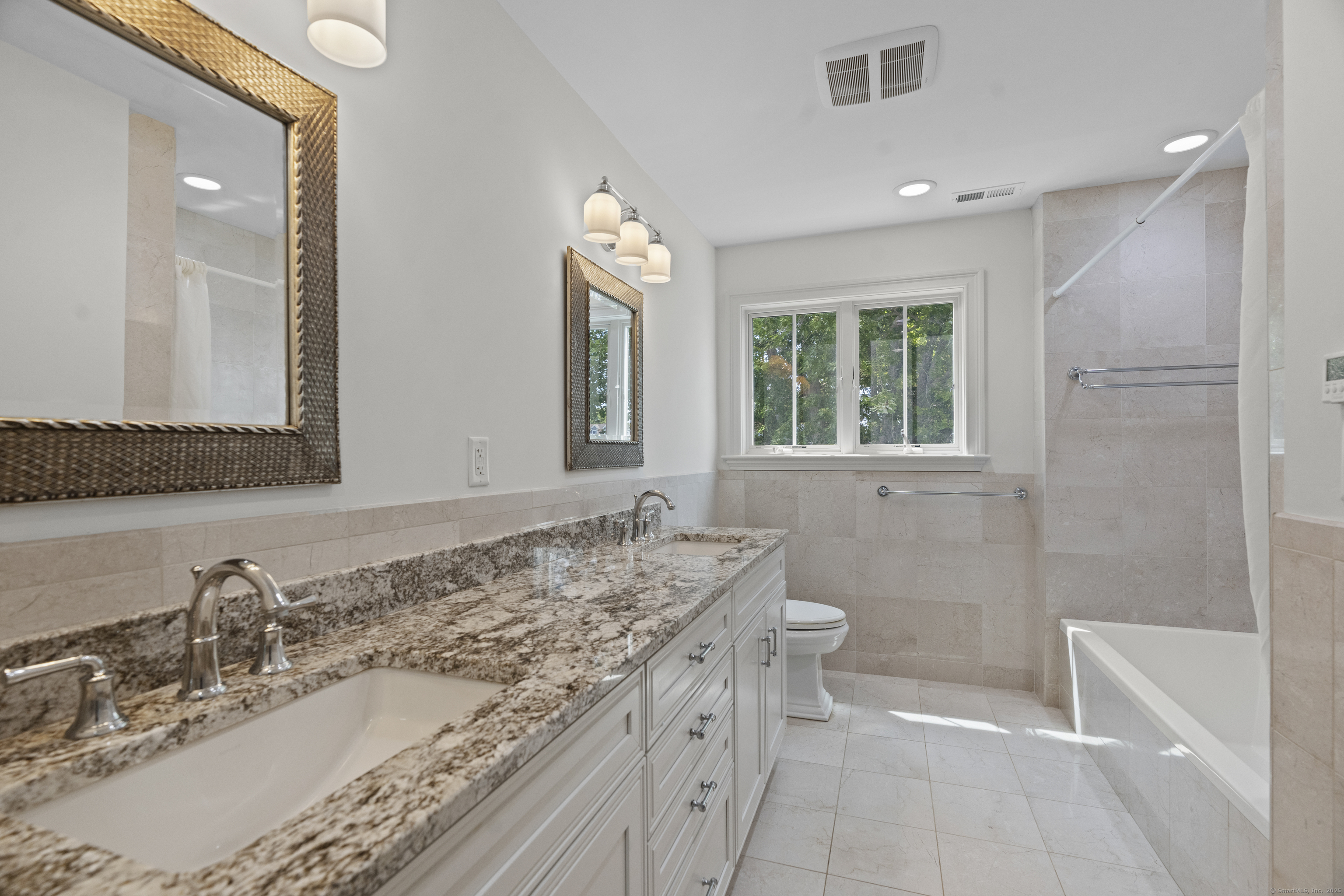 64 Webster Point Road Madison, CT 06443 - Photo 27 of 36 a bathroom with a granite countertop sink toilet and shower