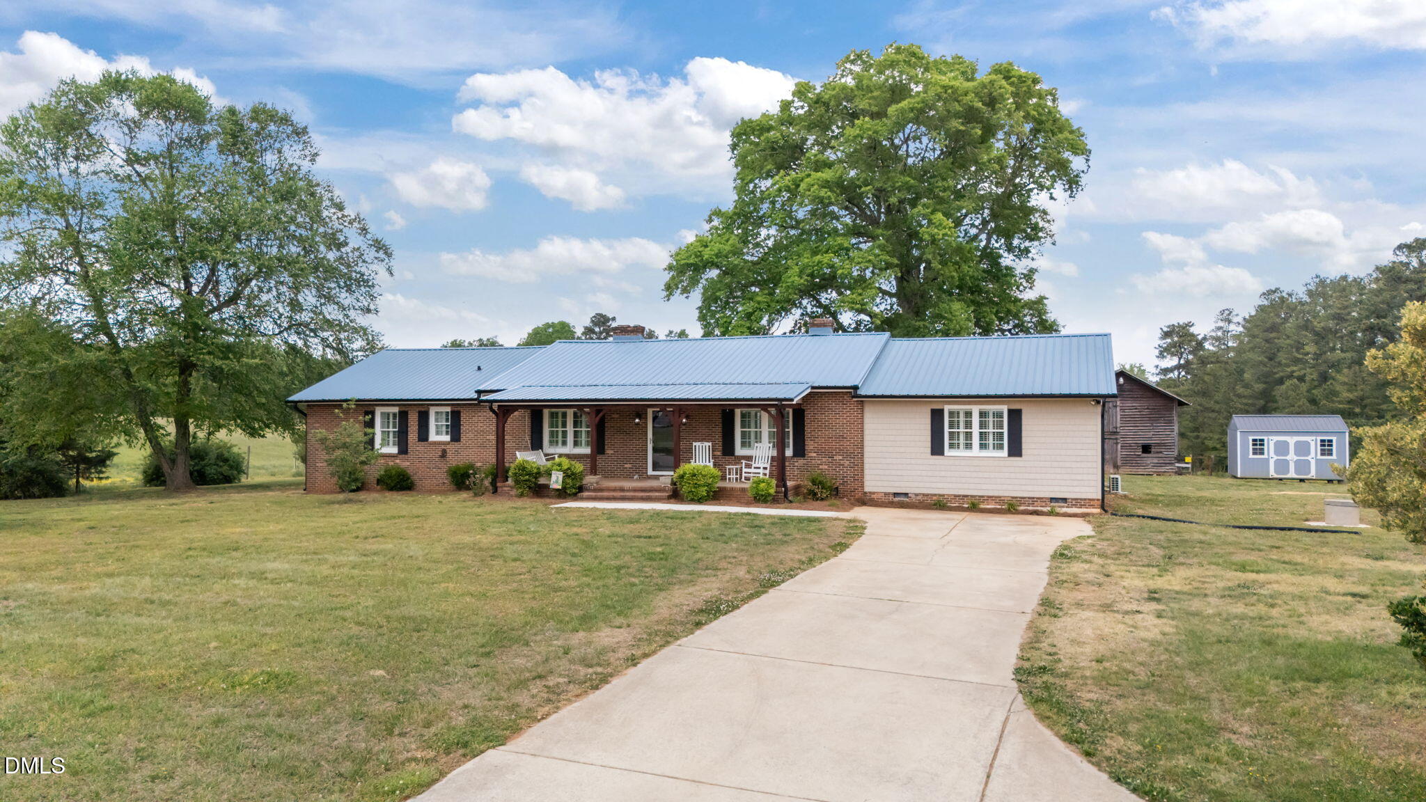 3611 Chewning Road Oxford, NC 27565 - Photo 28 of 45 a house with trees in the background