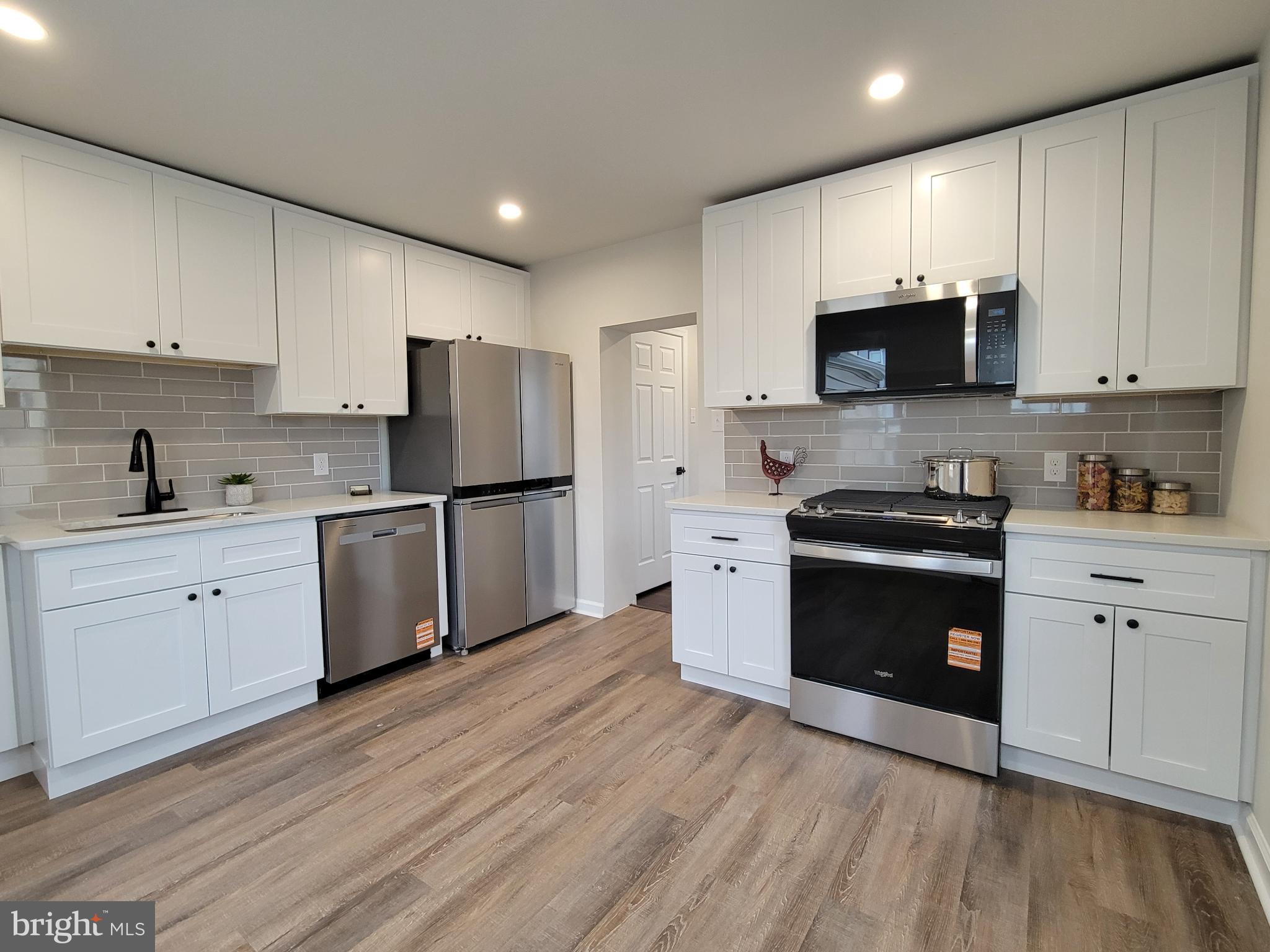 17 West 2nd Street Marcus Hook, PA 19061 - Photo 10 of 38 a kitchen with stainless steel appliances a refrigerator sink and cabinets