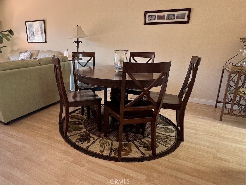 152 East Bowling Green Port Hueneme, CA 93041 - Photo 13 of 33 a view of a dining room with furniture and wooden floor
