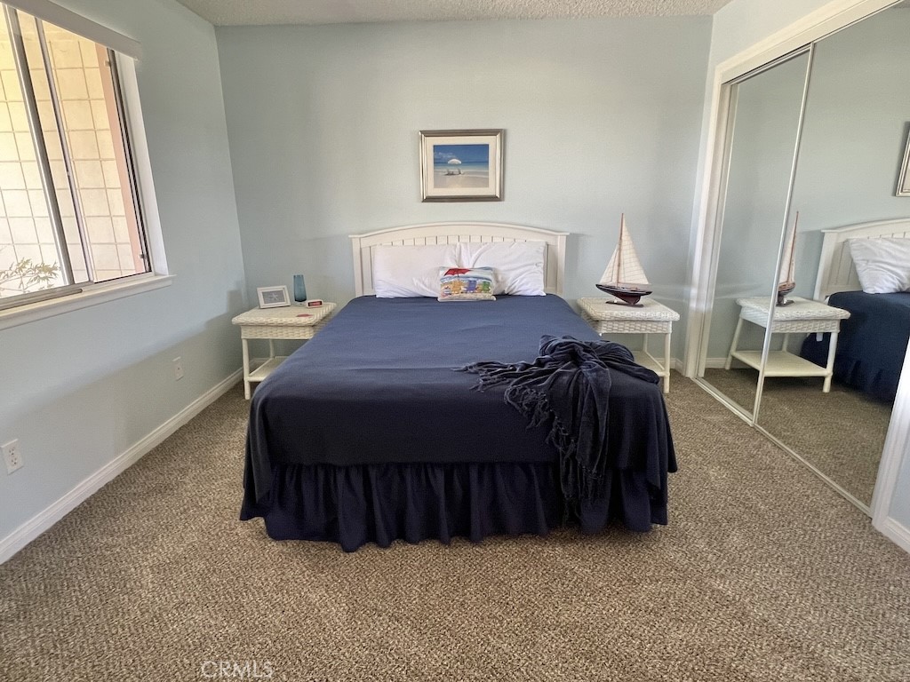 152 East Bowling Green Port Hueneme, CA 93041 - Photo 15 of 33 a bedroom with a bed and window