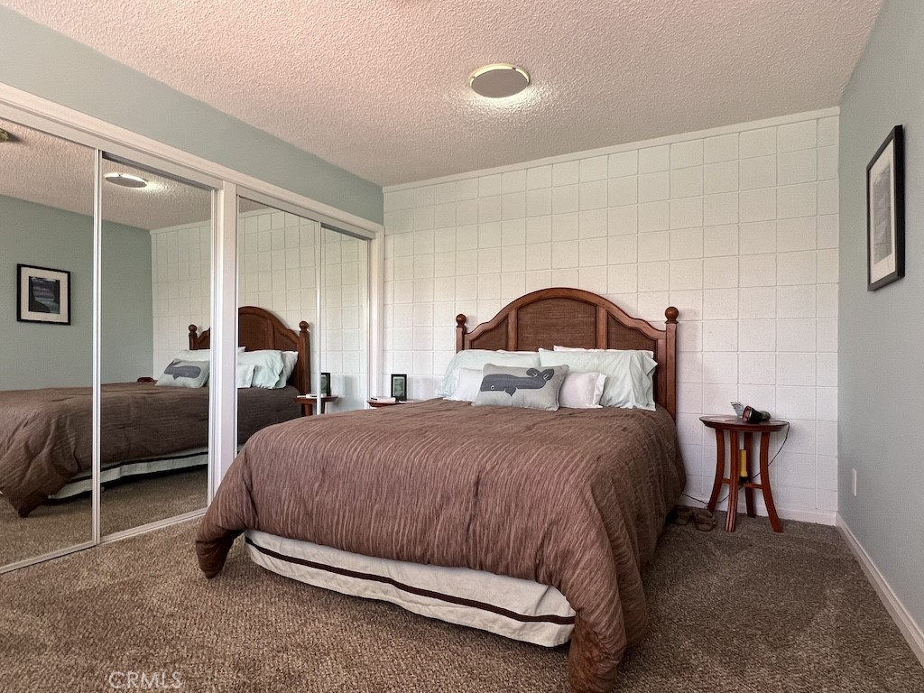 152 East Bowling Green Port Hueneme, CA 93041 - Photo 18 of 33 a bedroom with a bed and lamp