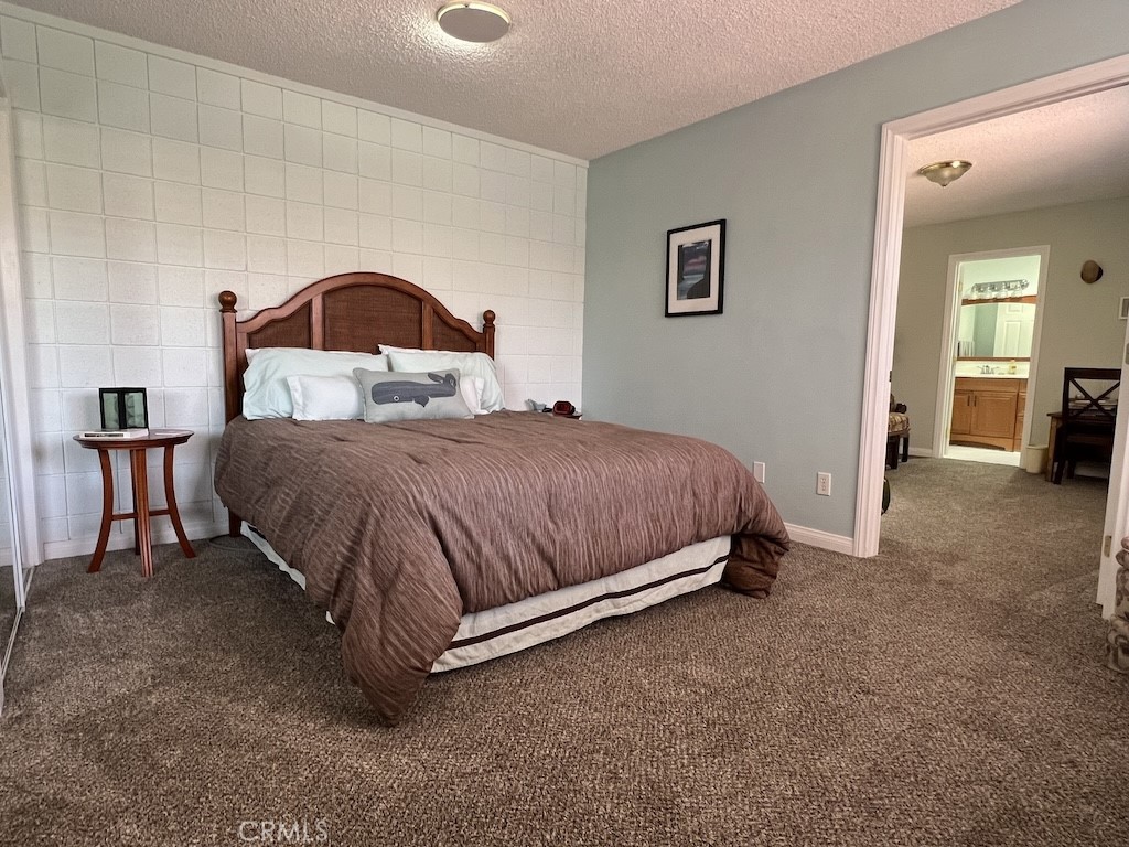 152 East Bowling Green Port Hueneme, CA 93041 - Photo 19 of 33 a bedroom with a bed and a view of kitchen