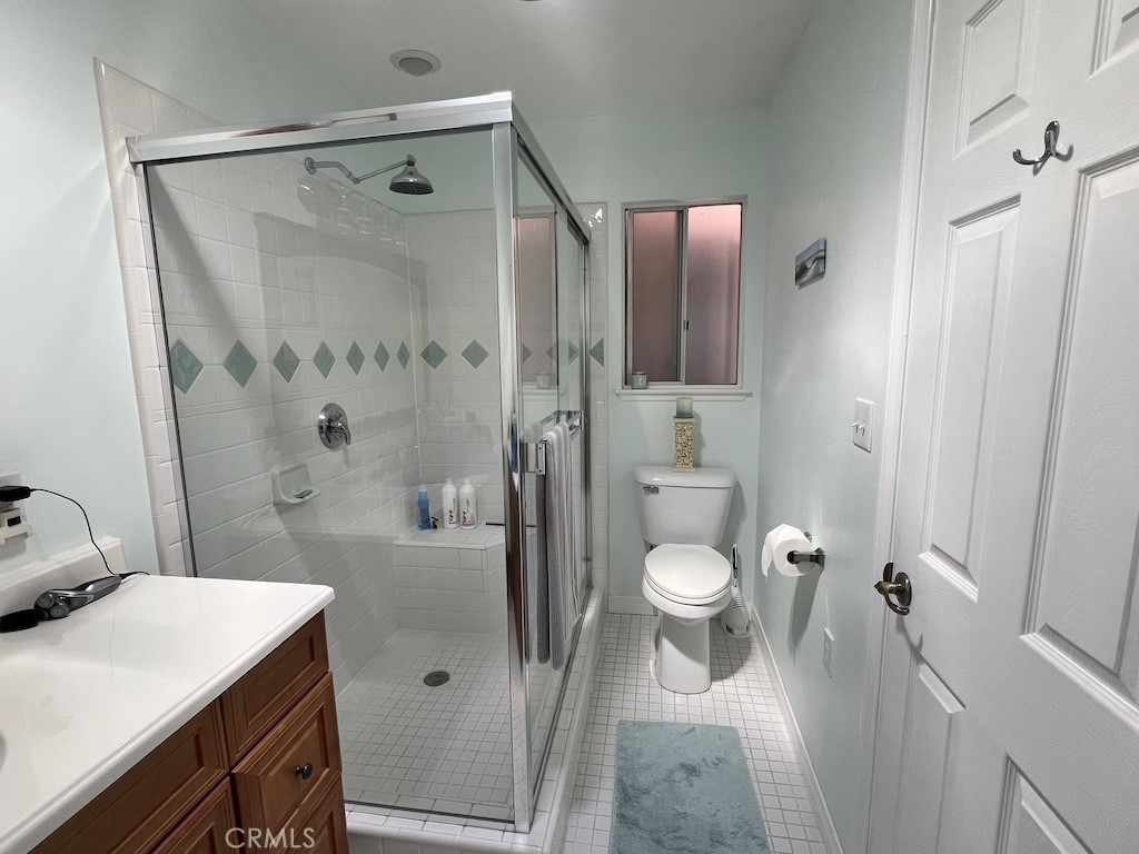 152 East Bowling Green Port Hueneme, CA 93041 - Photo 22 of 33 a bathroom with a granite countertop sink toilet and shower