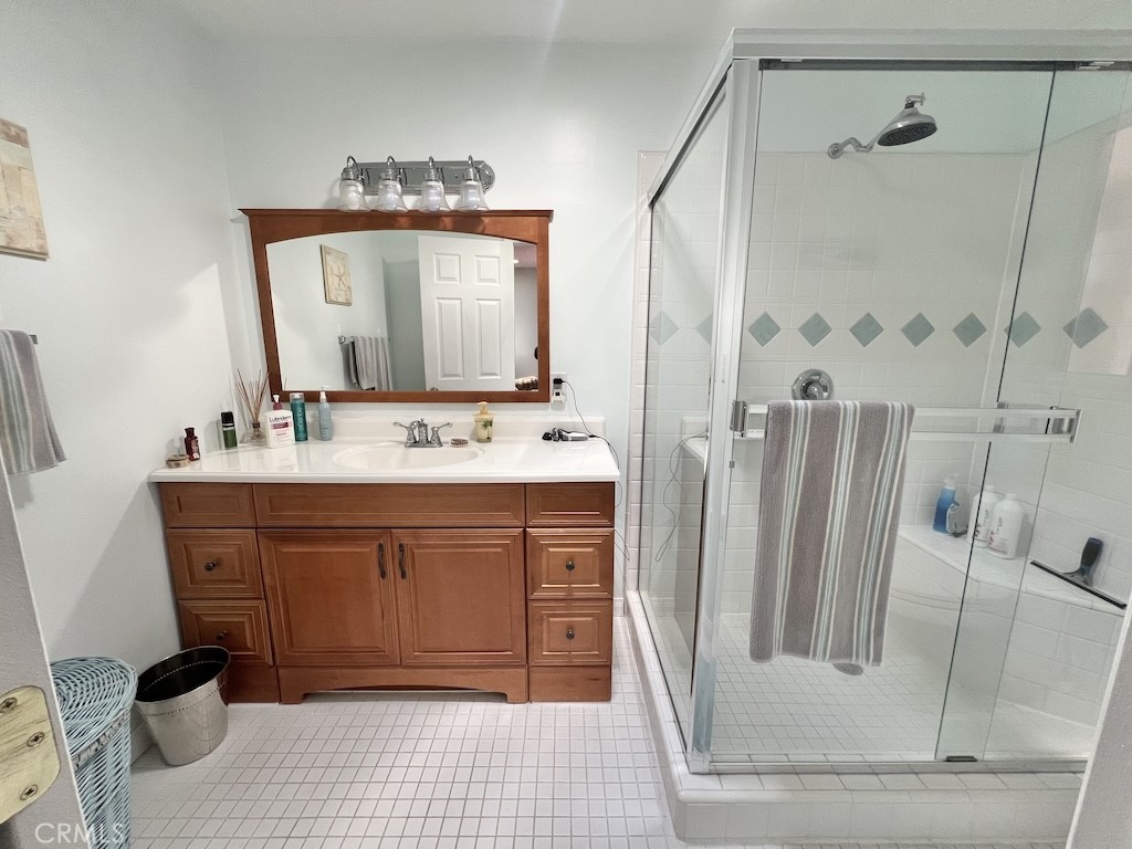 152 East Bowling Green Port Hueneme, CA 93041 - Photo 23 of 33 a bathroom with a sink a mirror and a shower