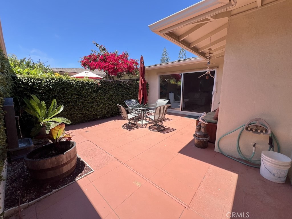 152 East Bowling Green Port Hueneme, CA 93041 - Photo 25 of 33 a view of a patio with table and chairs potted plants