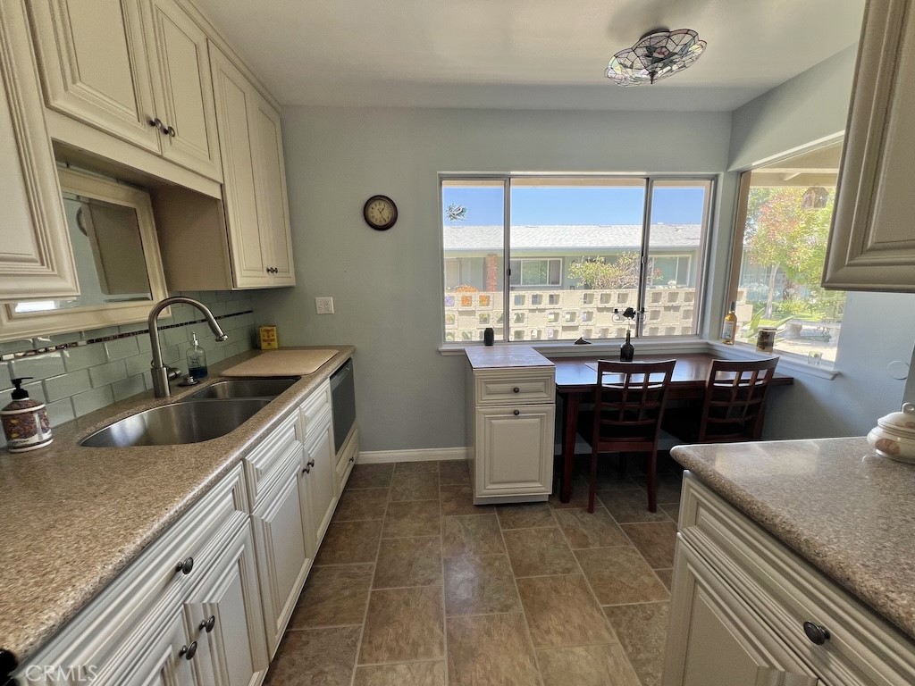 152 East Bowling Green Port Hueneme, CA 93041 - Photo 6 of 33 a kitchen with a sink stove and cabinets