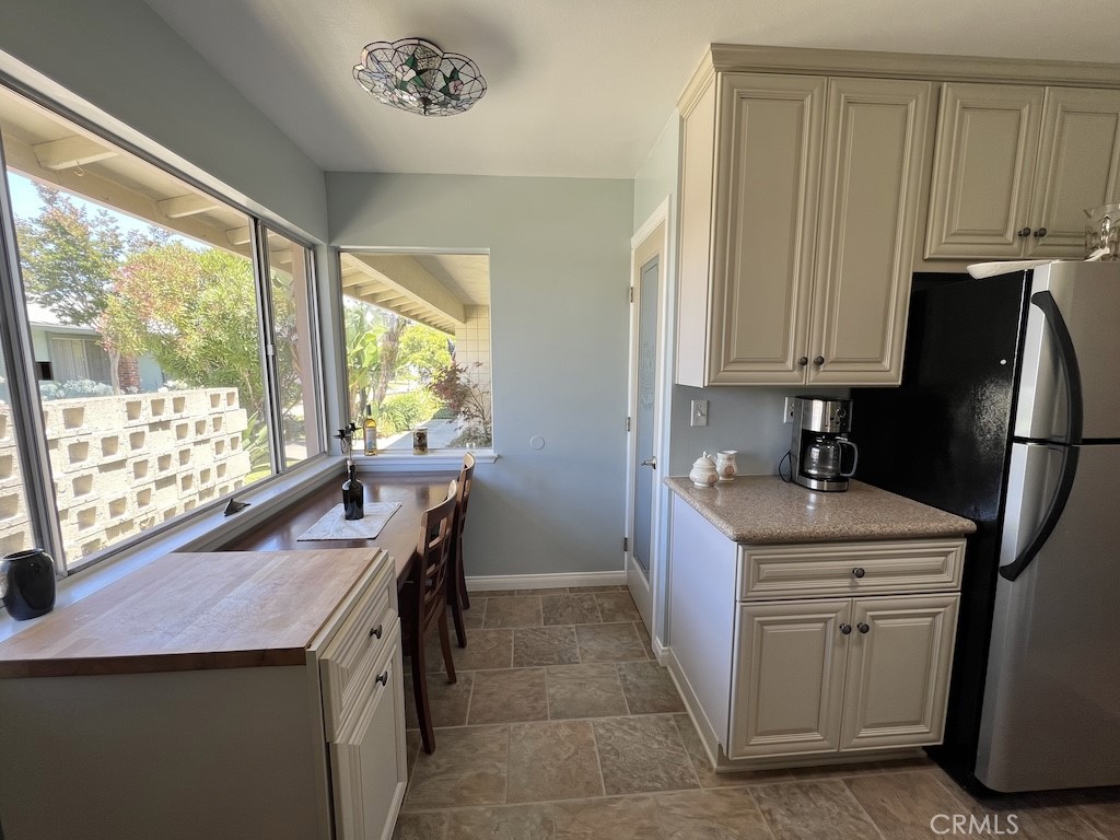 152 East Bowling Green Port Hueneme, CA 93041 - Photo 8 of 33 a kitchen with a stove a refrigerator and a window