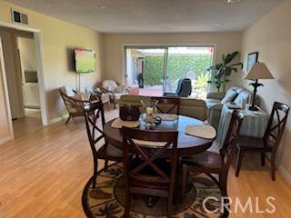 152 East Bowling Green Port Hueneme, CA 93041 - Photo 10 of 33 a dining room with furniture and wooden floor