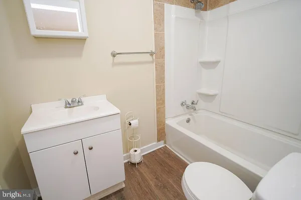 a bathroom with a bathtub and shower