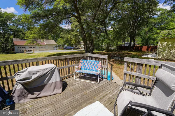 an empty room with wooden floor and closet
