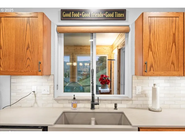 a kitchen with a sink and a window