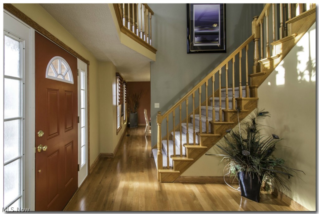5750 Beach Road Medina, OH 44256 - Photo 2 of 25 Impressive two story foyer with hardwood and new fixture.