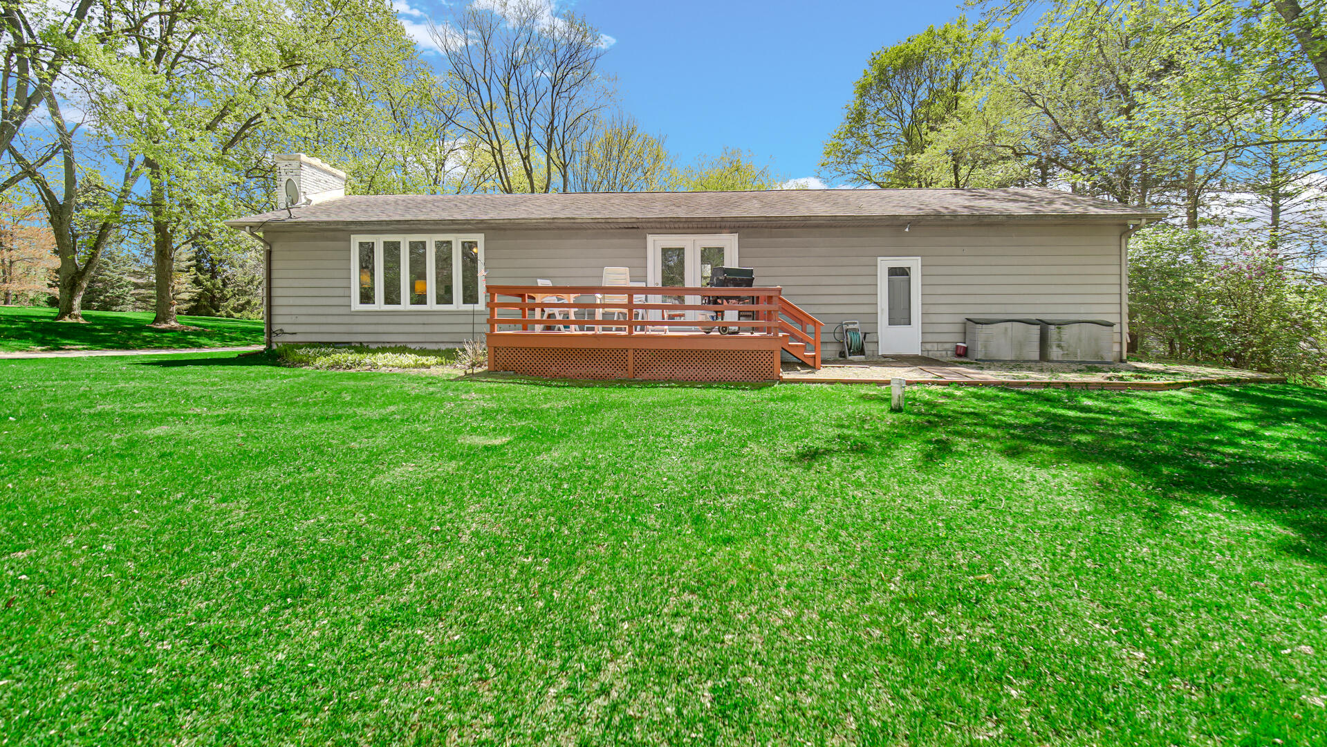 5505 West Schultz Road La Porte, IN 46350 - Photo 16 of 39 a front view of a house with a garden and deck