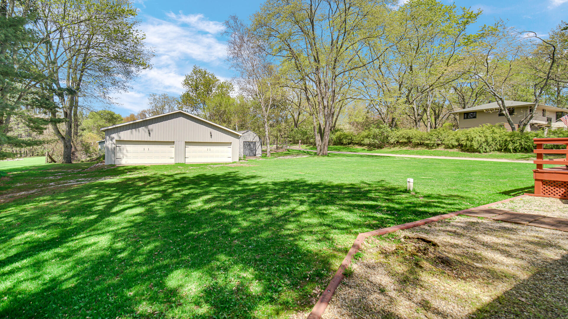 5505 West Schultz Road La Porte, IN 46350 - Photo 17 of 39 a white house with a big yard and large trees