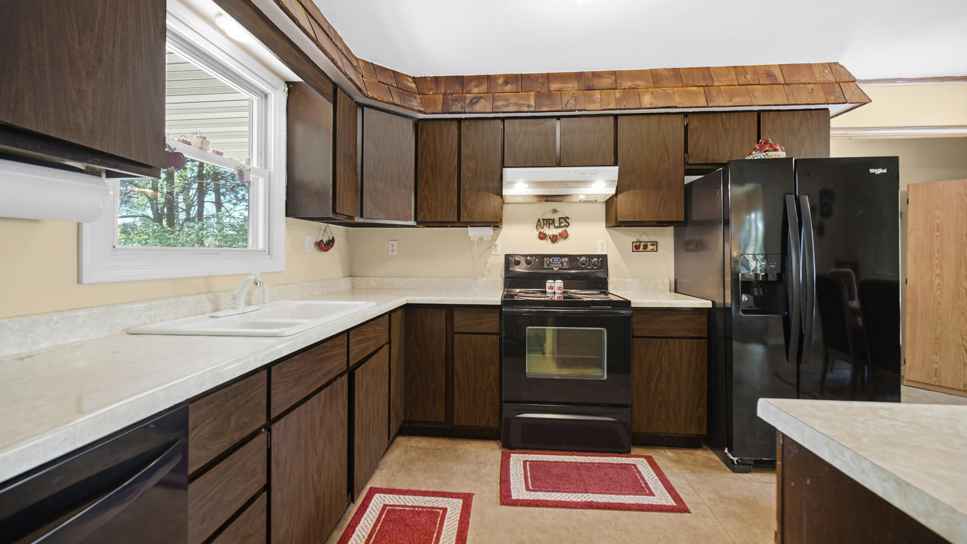 5505 West Schultz Road La Porte, IN 46350 - Photo 2 of 39 a kitchen with stainless steel appliances a refrigerator and a sink