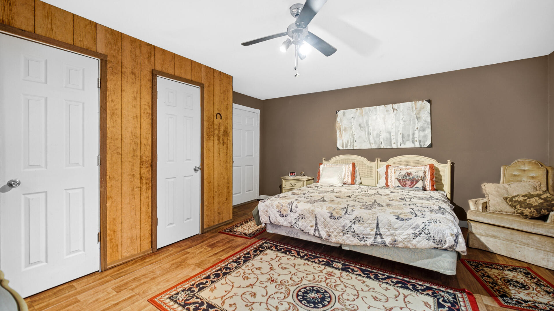 5505 West Schultz Road La Porte, IN 46350 - Photo 26 of 39 a bedroom with a bed and wooden floor