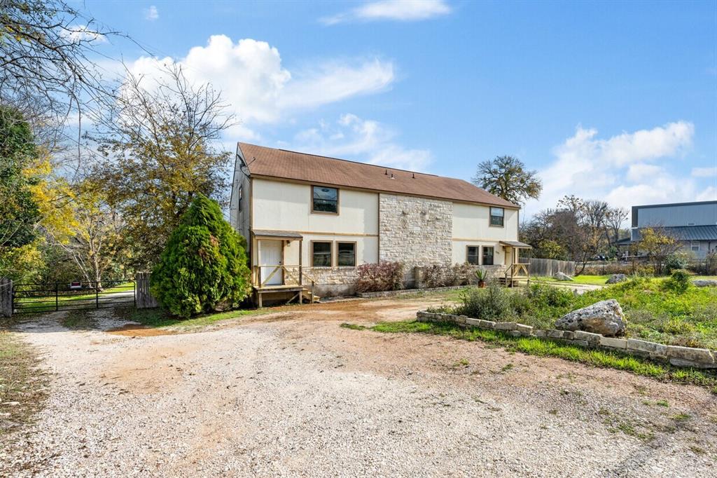 5205 Hudson Bend Road Austin, TX 78734 - Photo 2 of 21 a view of a house with a yard and pathway