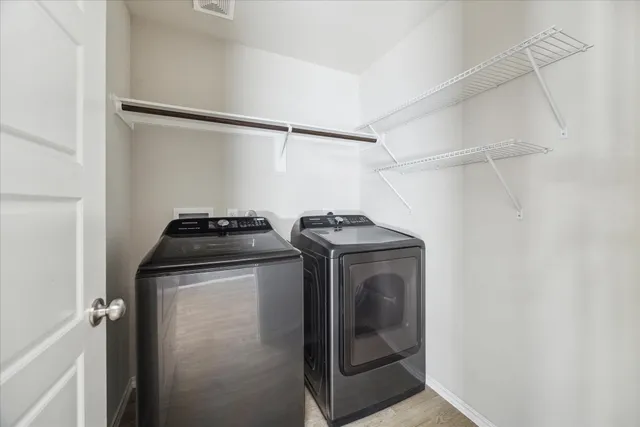 a utility room with dryer and washer