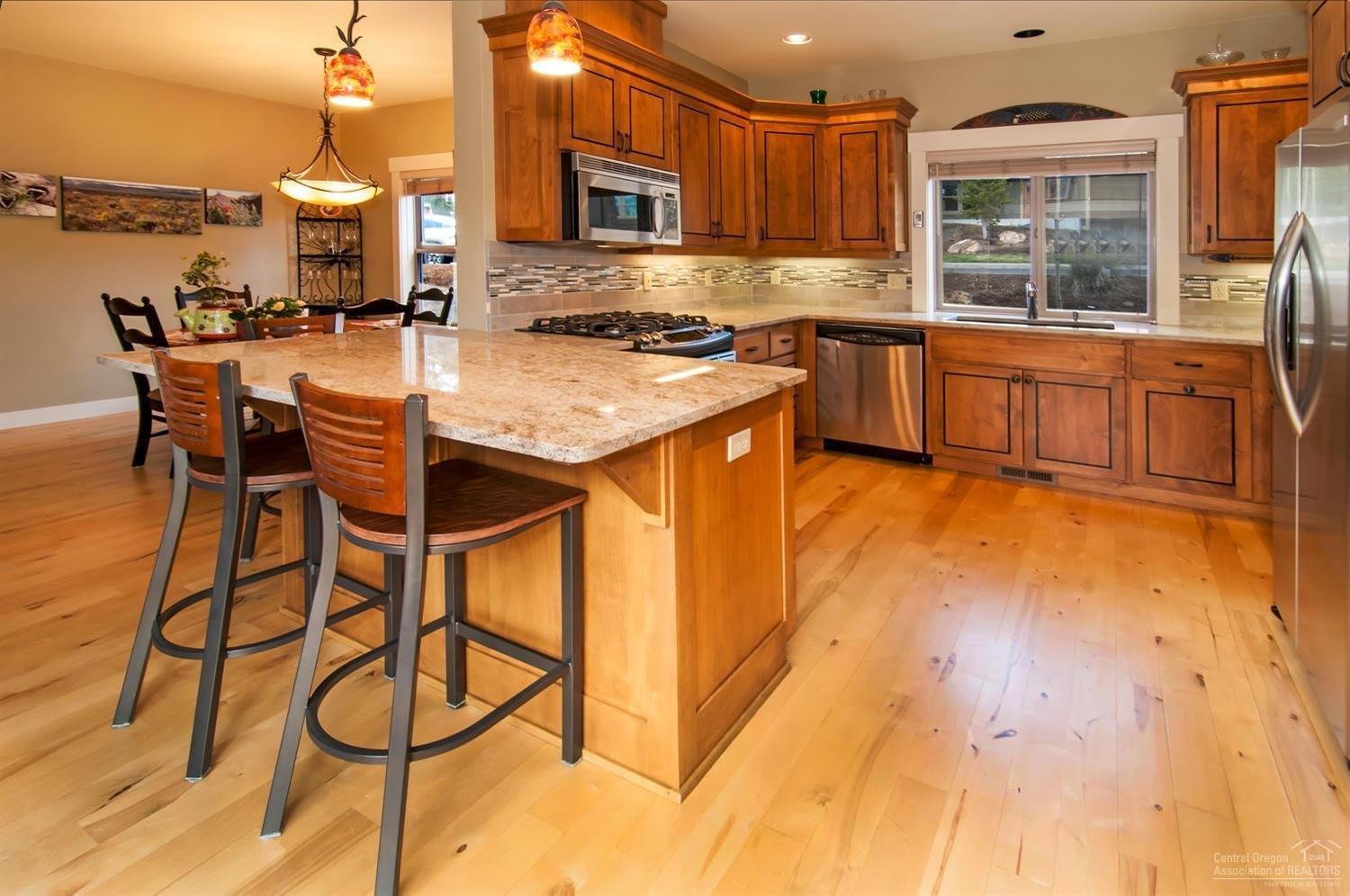 61428 Elder Ridge Street Bend, OR 97702 - Photo 3 of 25 Beautifully redone kitchen with solid-su