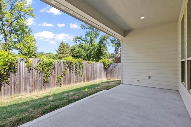 a view of entryway with flower plants