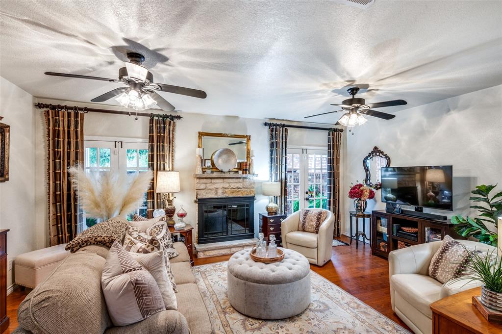 1349 Roaring Springs Road Fort Worth, TX 76114 - Photo 7 of 30 Living Room with Ceiling Fans, French Doors, and Fireplace