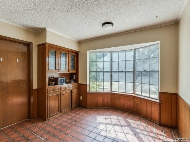 a view of a kitchen with a sink dishwasher and a refrigerator