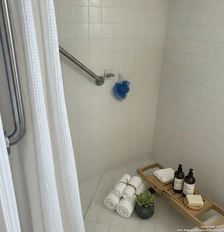 a bathroom with a sink and a shower