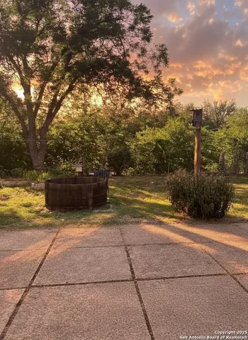 a view of a yard with an outdoor space