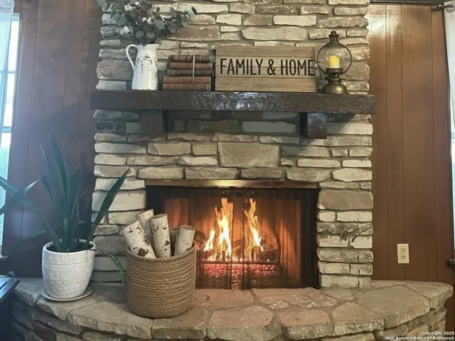 a kitchen with a table and a fireplace