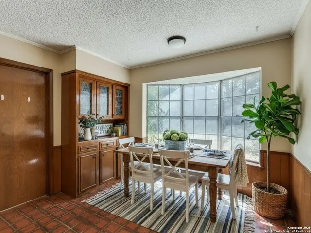a living room with furniture a window and a table