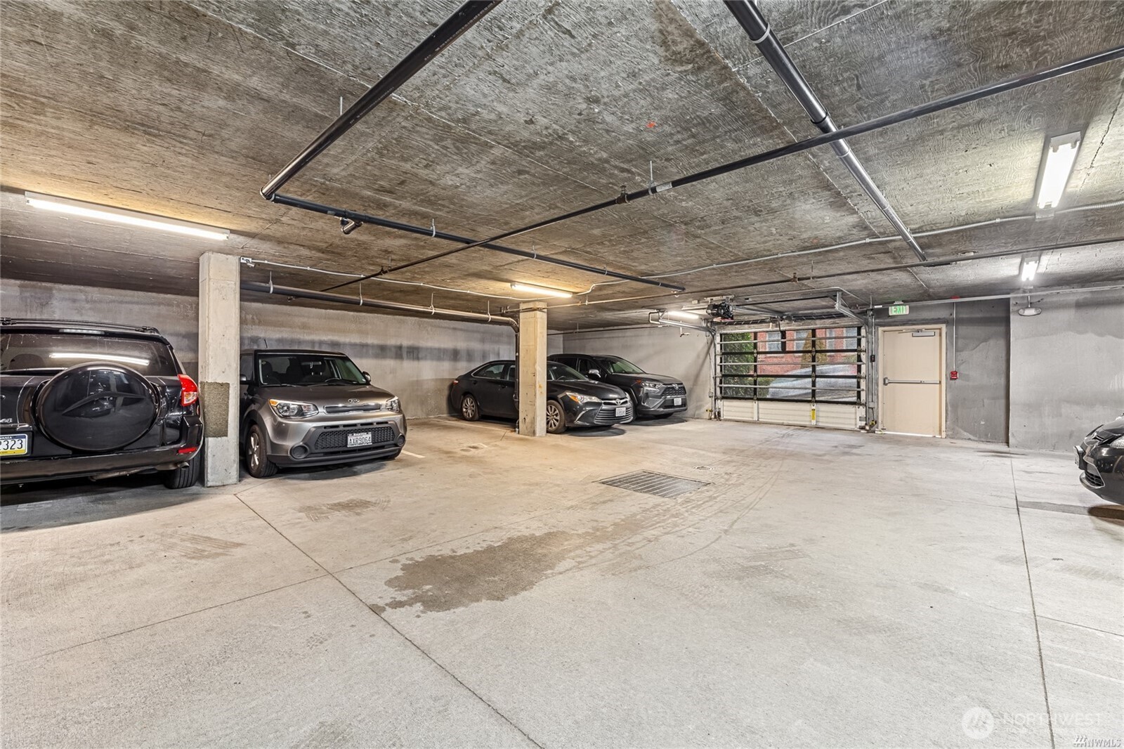 321 East Thomas Street, Unit 303 Seattle, WA 98102 - Photo 16 of 18 a view of garage with cars