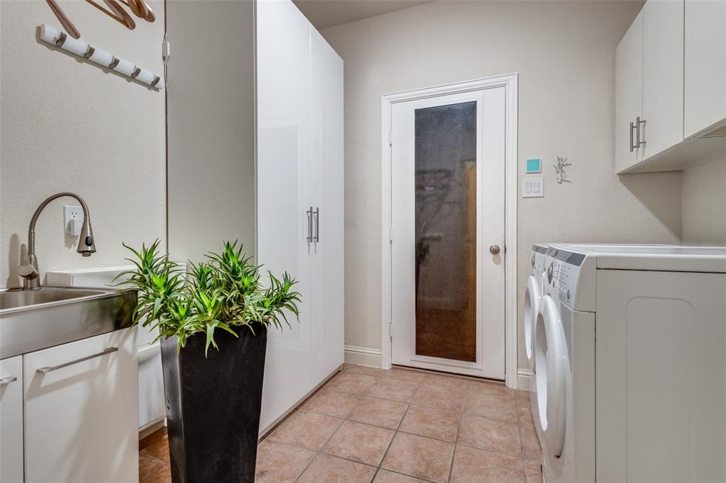 3313 Madison Avenue Hurst, TX 76054 - Photo 34 of 36 Full sized laundry room with deep utility sink and newer modern washer and dryer included in rent.