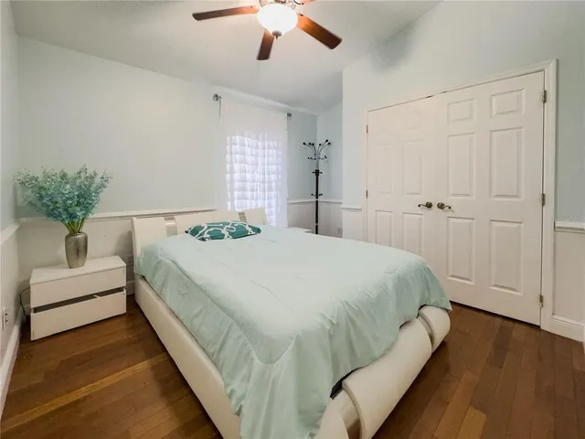 a spacious bedroom with a bed and a couch