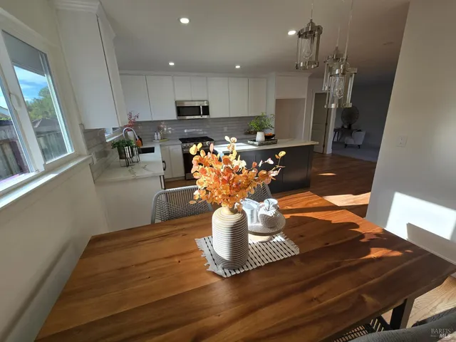 a view of kitchen with furniture and a potted plant