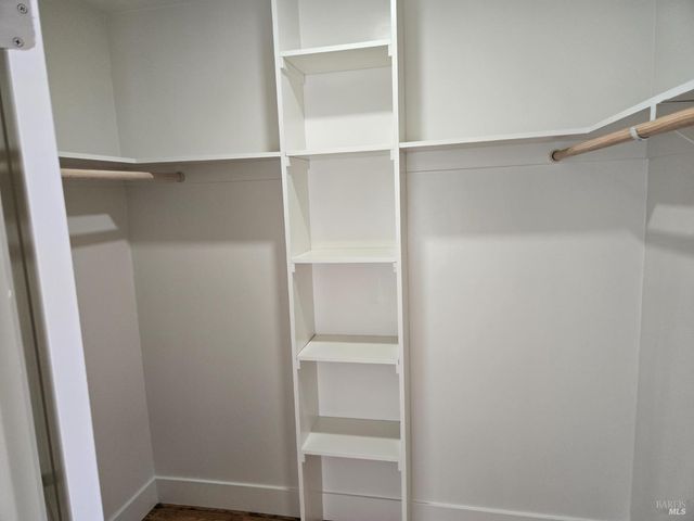 a view of an empty walk in closet