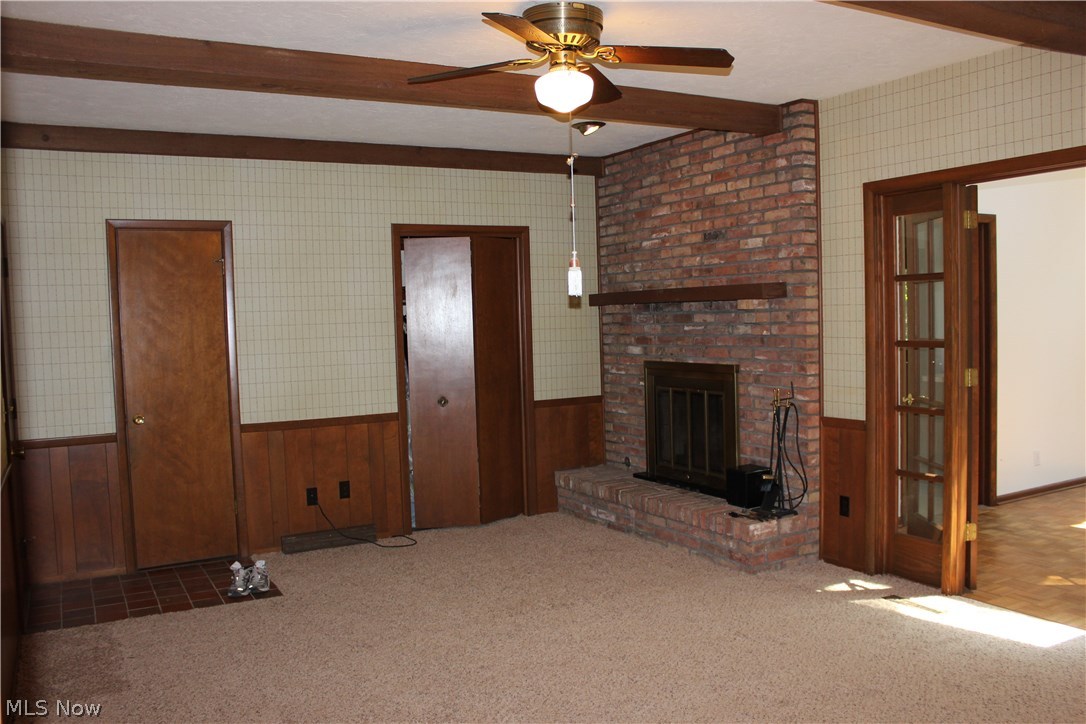 943 Roland Road Lyndhurst, OH 44124 - Photo 9 of 17 Family Room with beamed ceiling and raised hearth fireplace.