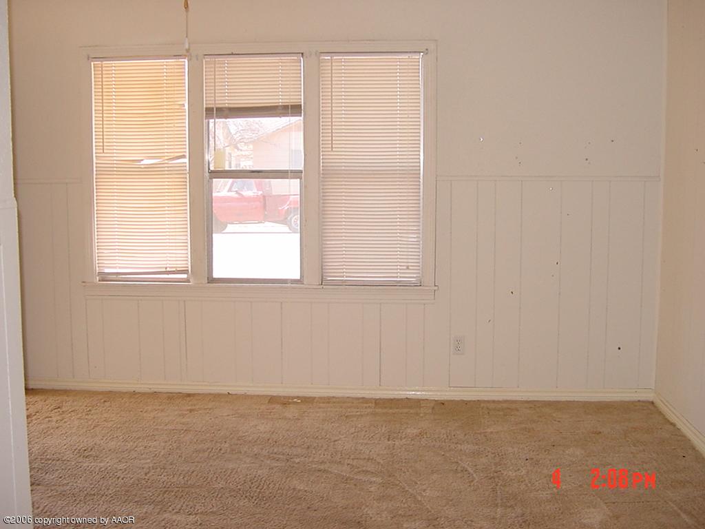 4113 Gables Street Amarillo, TX 79110 - Photo 2 of 8 a view of an empty room with a window