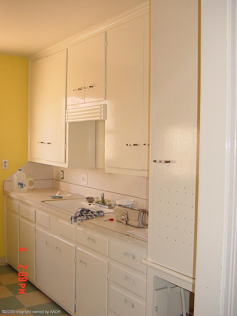 4113 Gables Street Amarillo, TX 79110 - Photo 3 of 8 a bathroom with a sink and a mirror