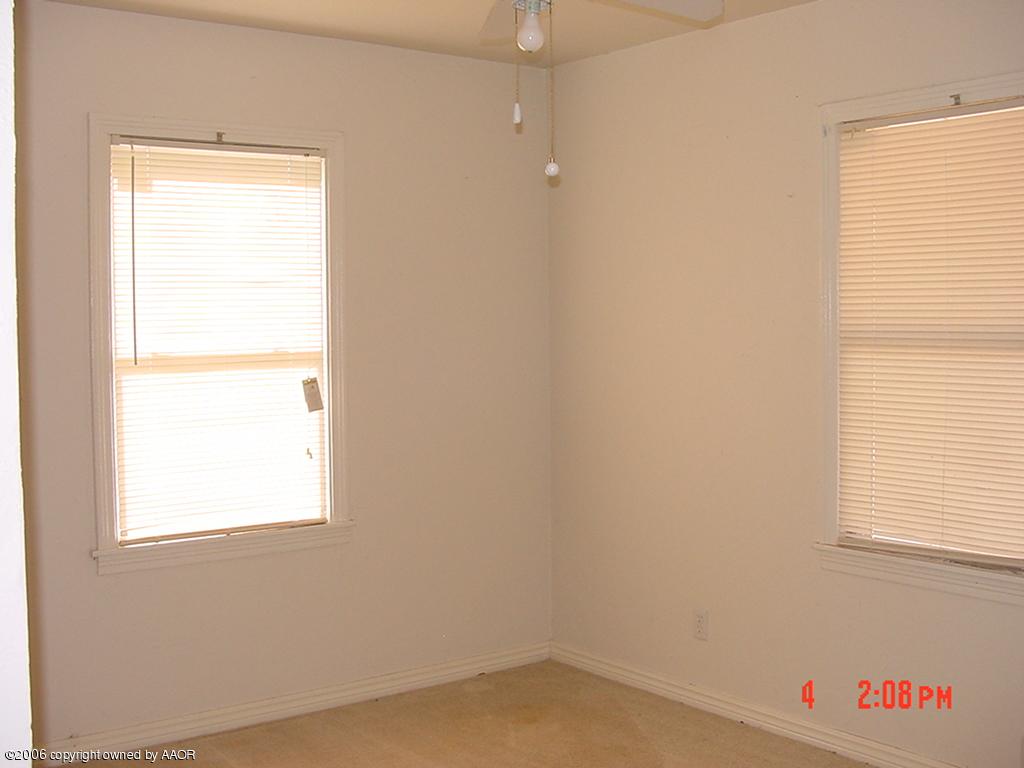 4113 Gables Street Amarillo, TX 79110 - Photo 5 of 8 an empty room with a window