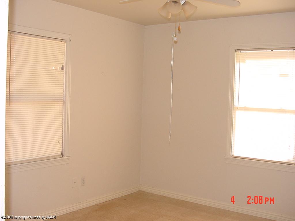 4113 Gables Street Amarillo, TX 79110 - Photo 6 of 8 a room with a window and a ceiling fan