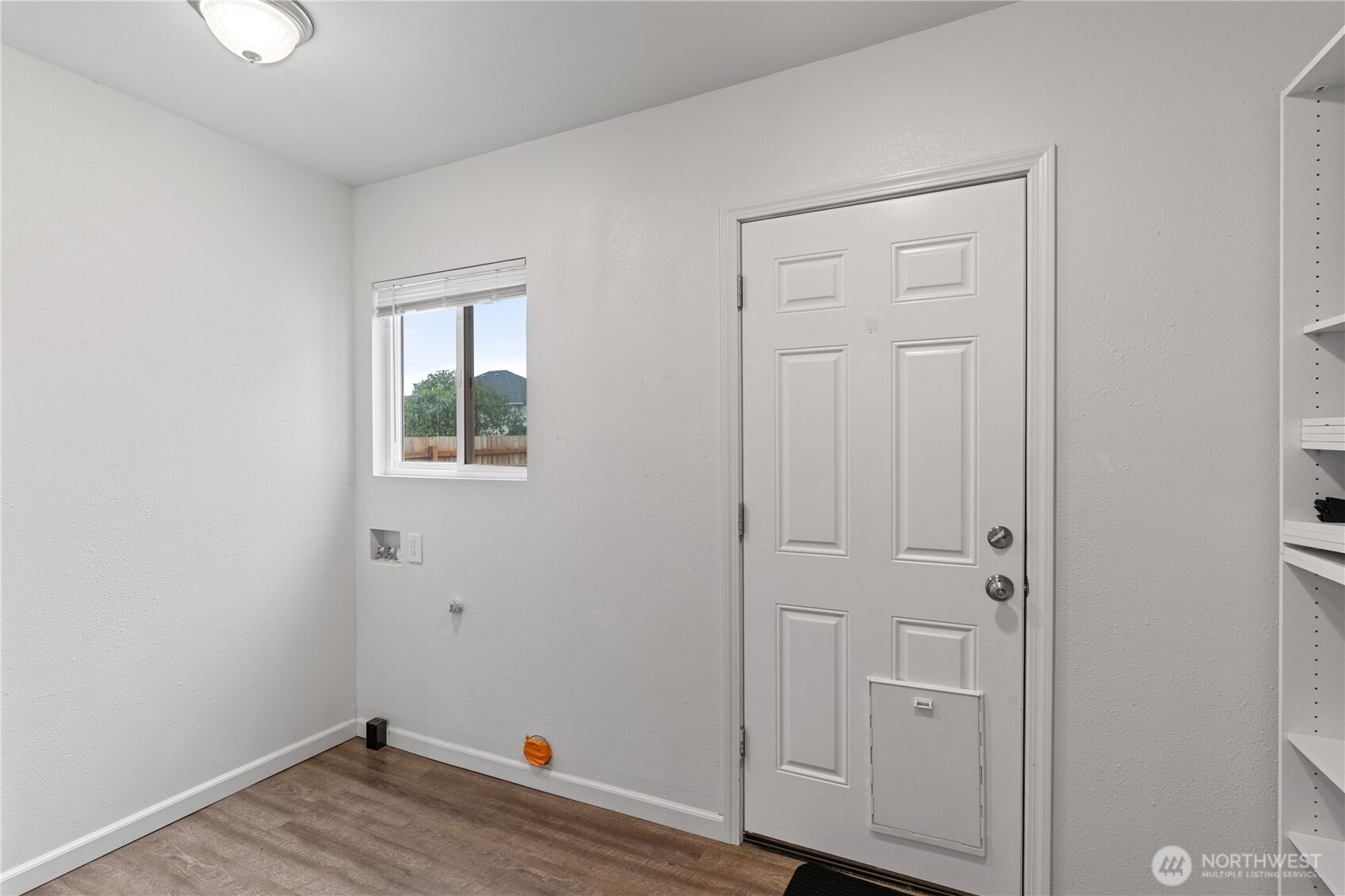 508 30th Street Hoquiam, WA 98550 - Photo 11 of 40 an empty room with wooden floor and closet area