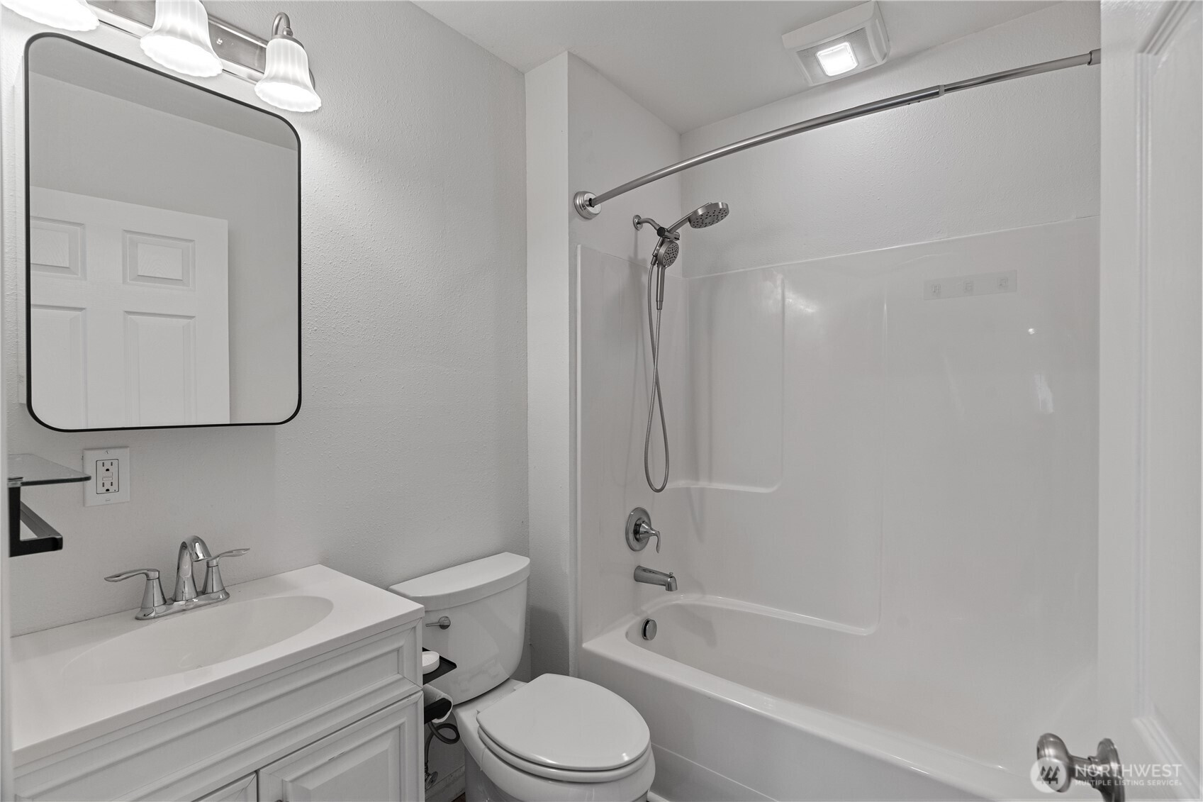 508 30th Street Hoquiam, WA 98550 - Photo 16 of 40 a bathroom with a bathtub shower sink vanity mirror and toilet