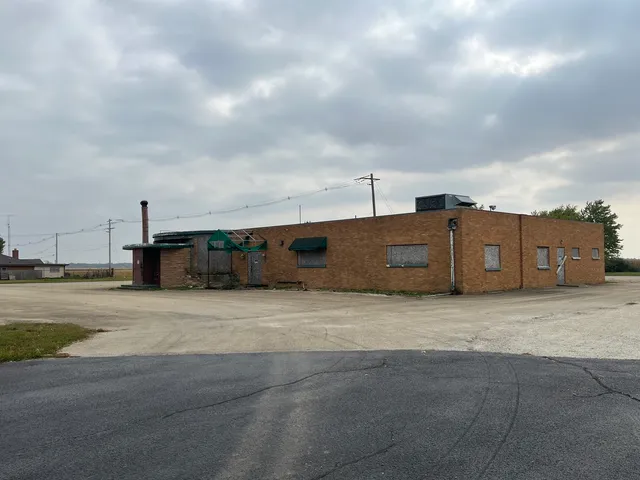 a city view with wooden fence