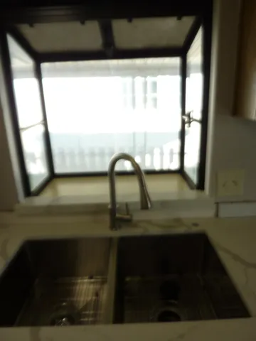 a bathroom with a sink and a window
