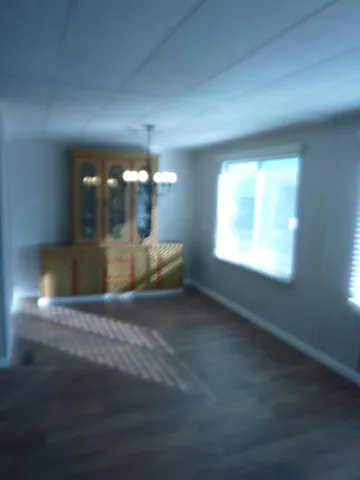 a bathroom with a glass shower door and a mirror