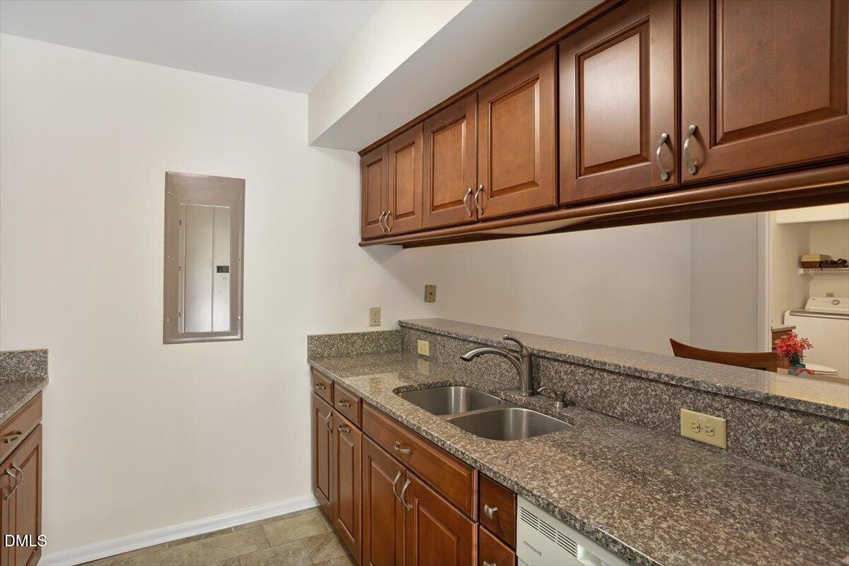 163 Springberry Lane Chapel Hill, NC 27517 - Photo 5 of 32 a kitchen with stainless steel appliances granite countertop a sink and dishwasher