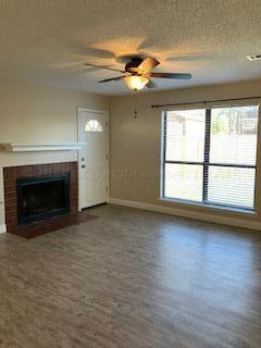 5708 Coral Circle Amarillo, TX 79110 - Photo 5 of 13 a view of empty room with wooden floor and fan