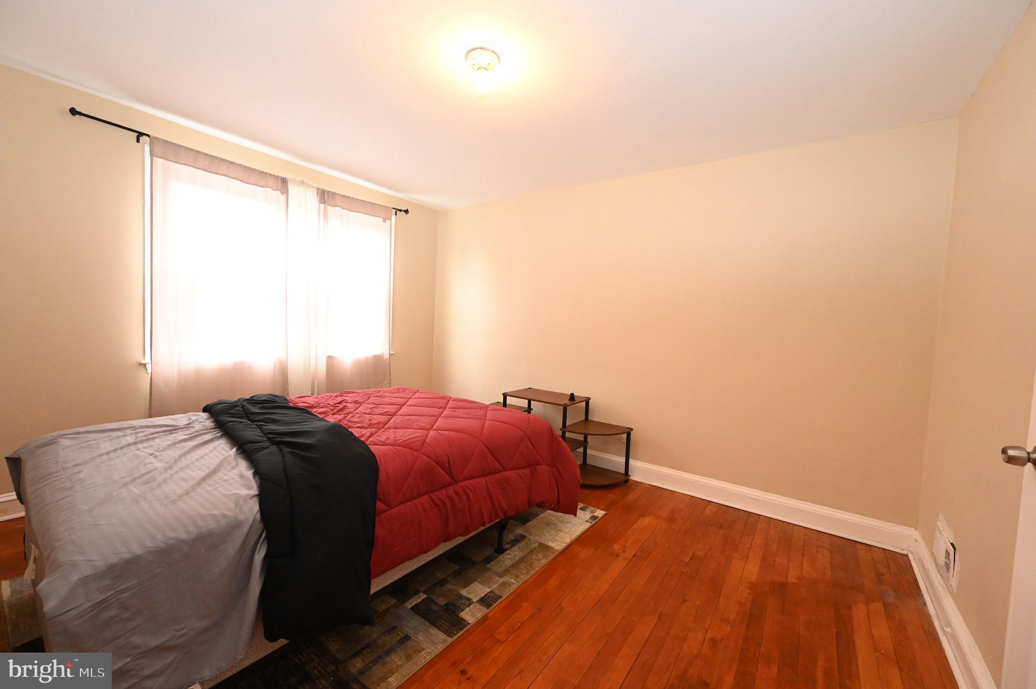 2458 Nevada Street Baltimore, MD 21230 - Photo 13 of 19 a bedroom with a bed and a window