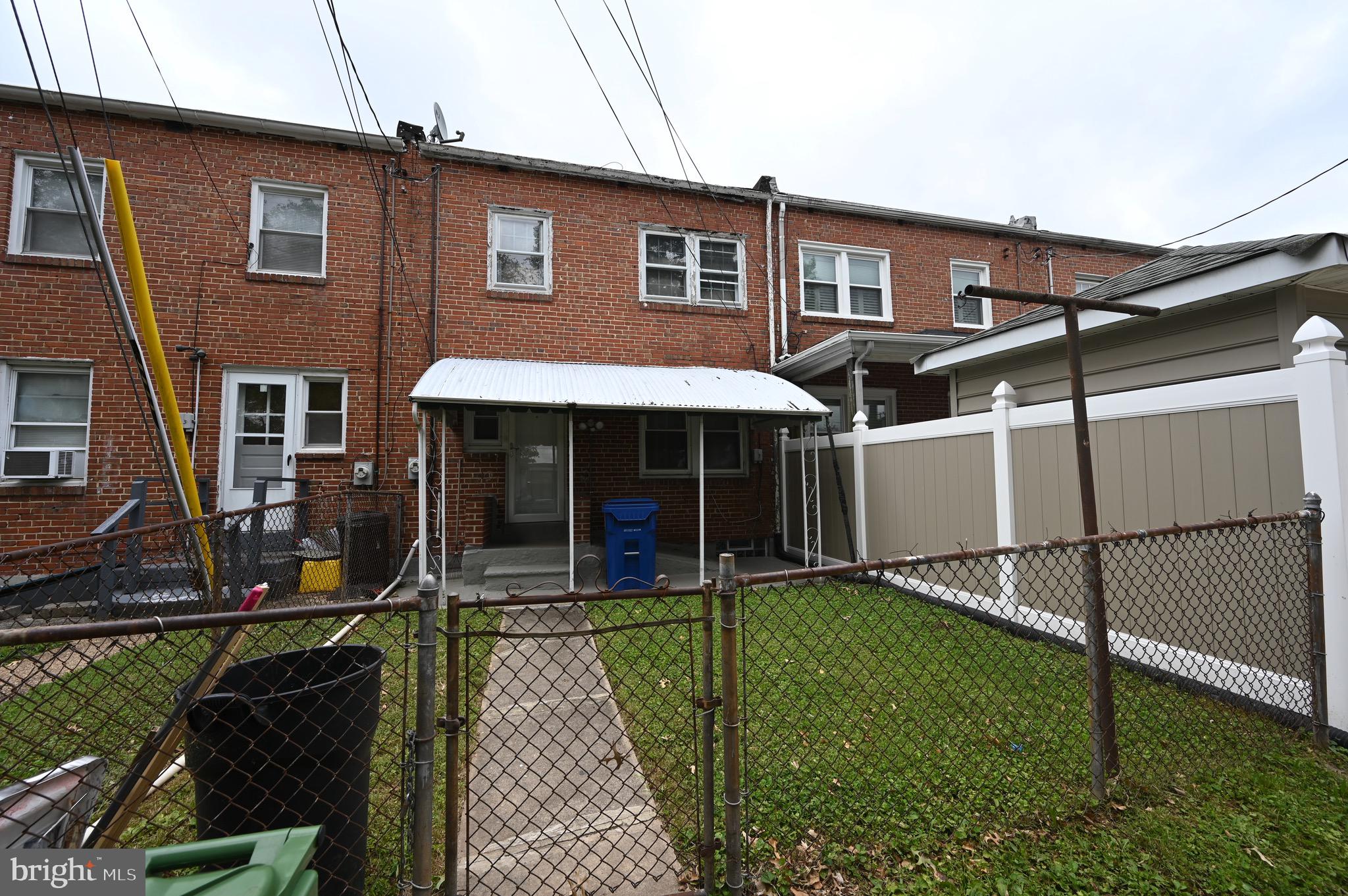 2458 Nevada Street Baltimore, MD 21230 - Photo 18 of 19 a front view of a house with garden